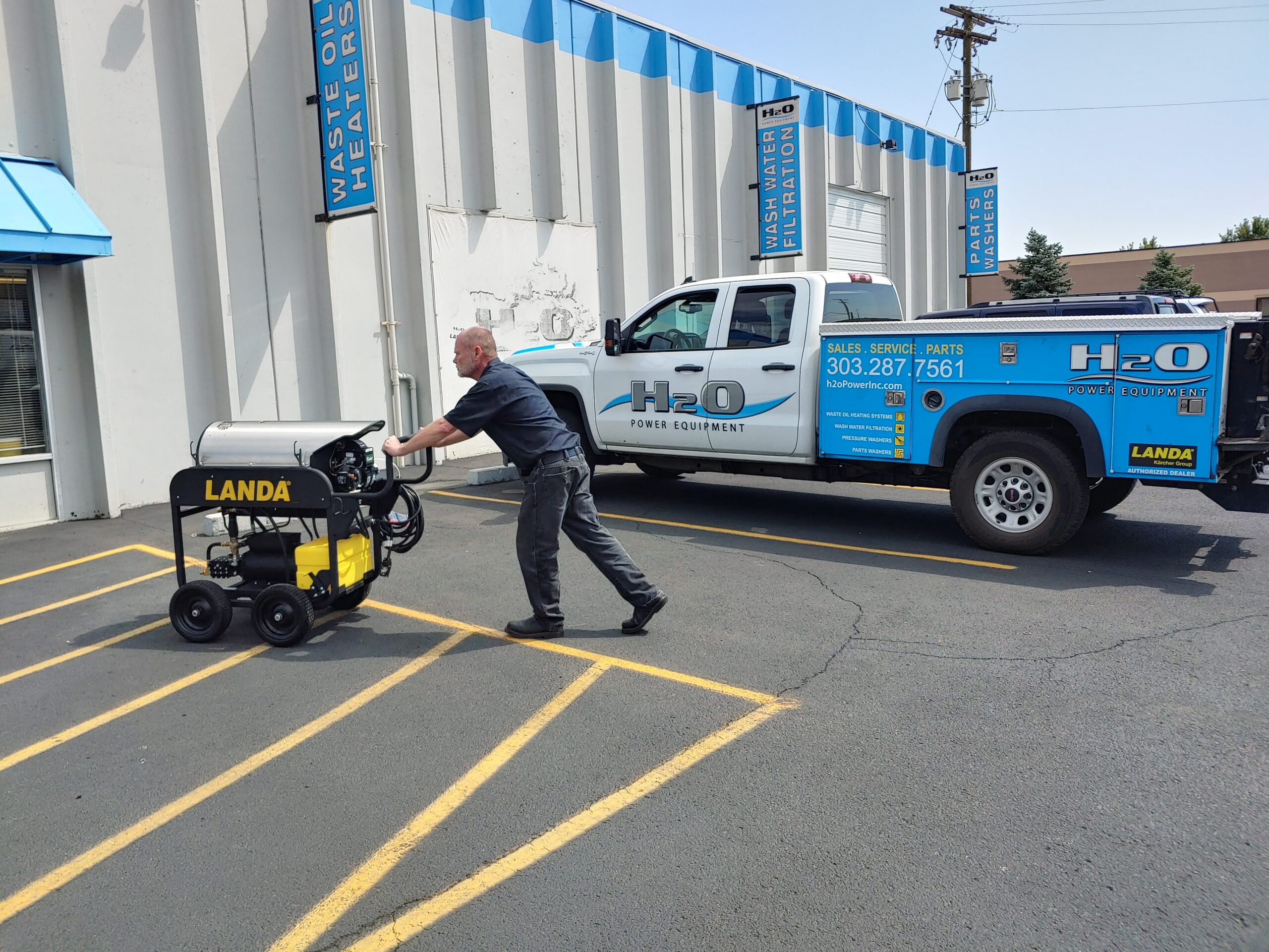 H2O Power Equipment team and delivery truck in action